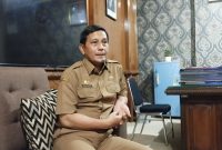 Kepala Dinsos P3A Sumenep, Mustangin, saat menjelaskan tentang peruntukan DBHCHT Rp 4,8 Miliar (Za - garudajatim.com) 