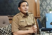 Kepala Dinsos P3A Sumenep, Mustangin, saat mengungkapkan tentang kuota program pendidikan gratis (Za - garudajatim.com) 