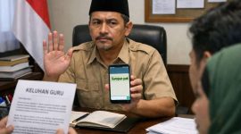 Foto ilustrasi Kepala SPPG Legung Barat, Sumenep, Yayasan At-ta’awun, Adam Ramadhan Rifa’i, saat merespon wawancara media dengan singkat (Ris - garudajatim.com)