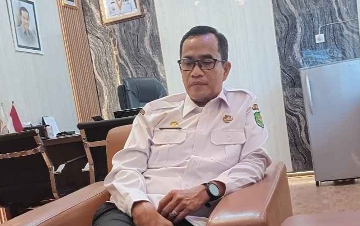 Kepala Badan Kepegawaian dan Pengembangan Sumber Daya Manusia (BKPSDM) Sumenep, Benny Irawan, saat diwawancarai di ruang kerjanya (Istimewa - garudajatim.com)