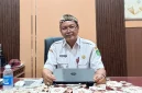 Kepala Dinas Sosial Kabupaten Sumenep, R. Abd. Rahman Riadi, saat diwawancarai ruangannya (Istimewa - garudajatim.com)