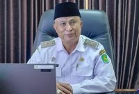 Kepala Disdik Sumenep, Moh. Iksan, saat diwawancarai di ruangannya (Istimewa - garudajatim.com)